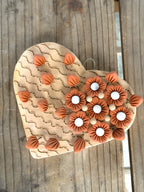 Decoración de pared floral con forma de corazón